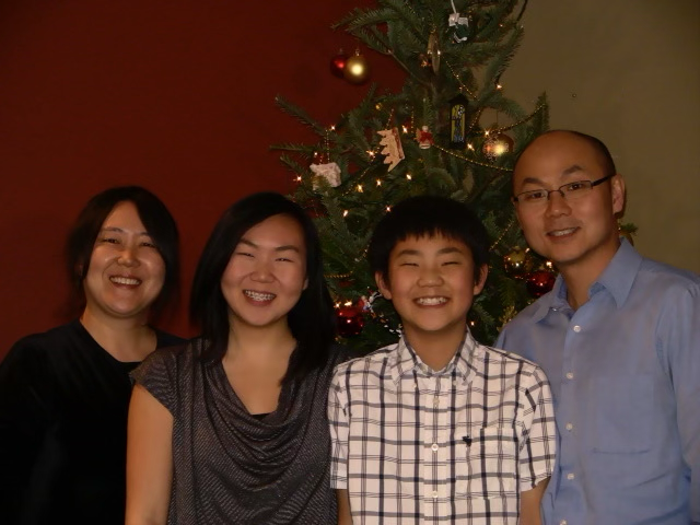 Young Ko family in front of tree